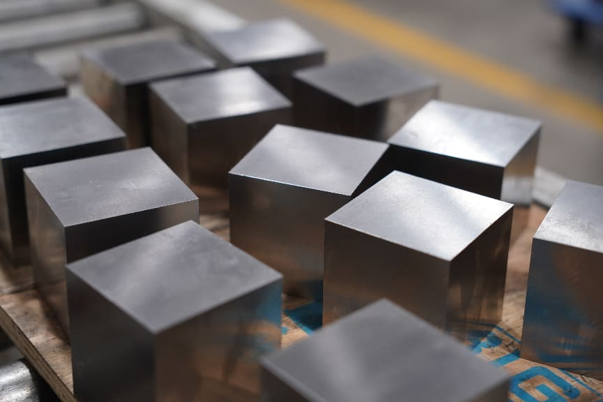 Saw-cut and pre-machined mold steel blocks prepared for machining