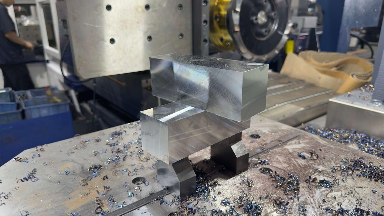 Machined mold steel block showing finished reference surfaces