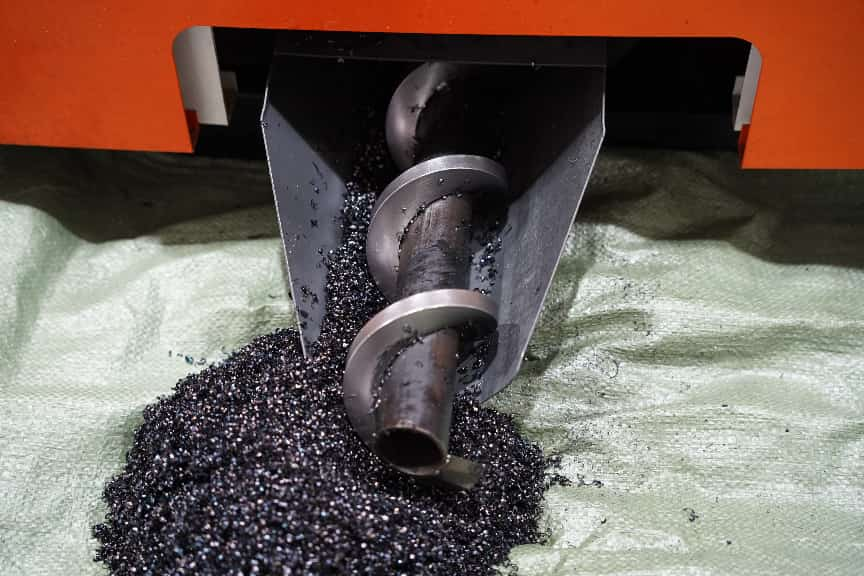 Metal chips being removed from a circular saw cutting system