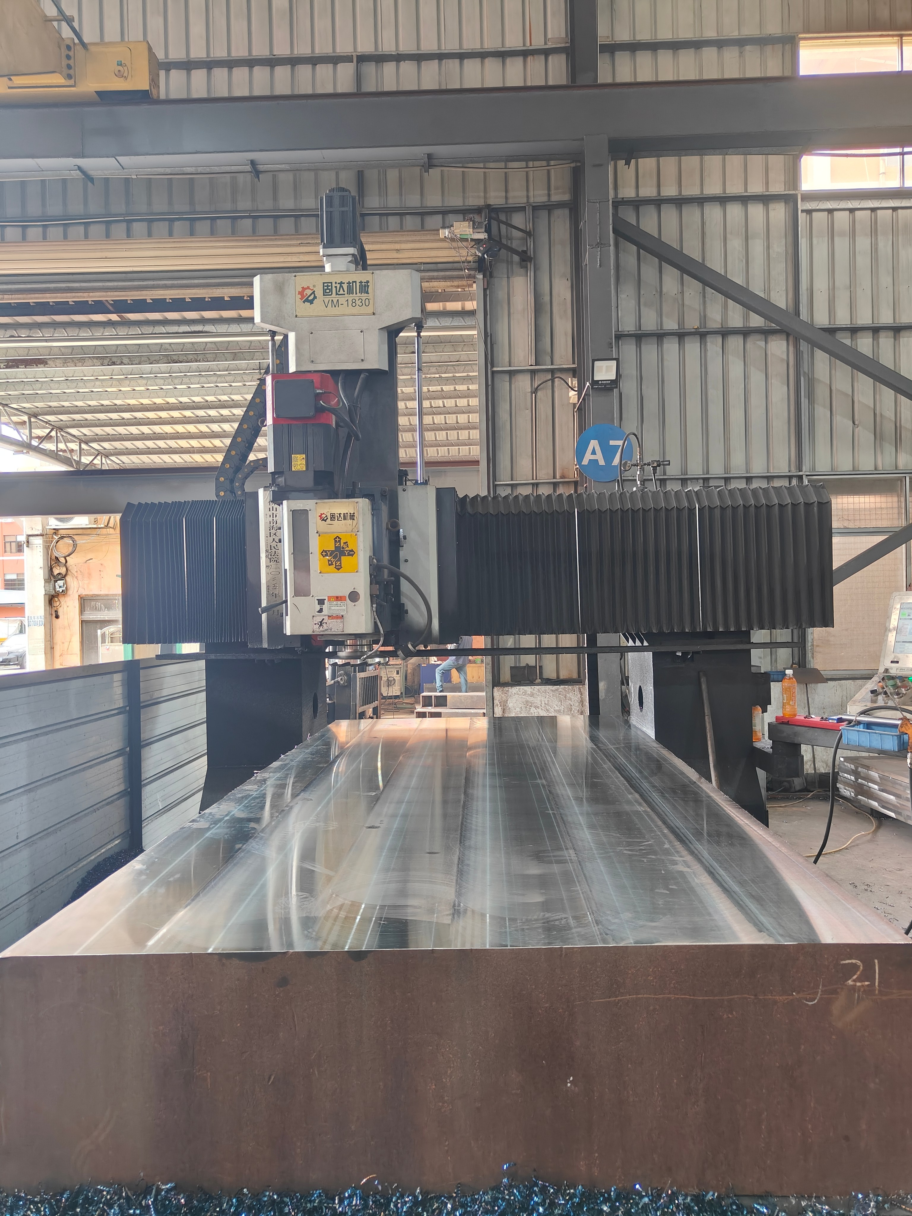 Large gantry machining center working over a wide workpiece