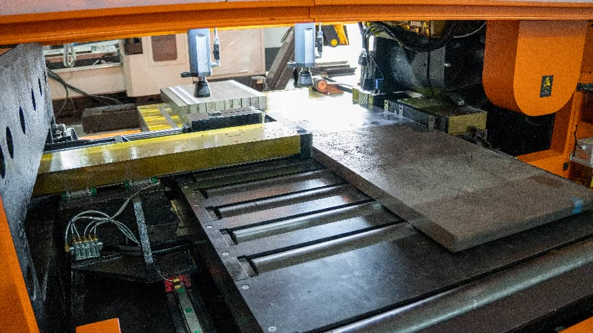 Mold steel plate positioned on an industrial cutting machine table