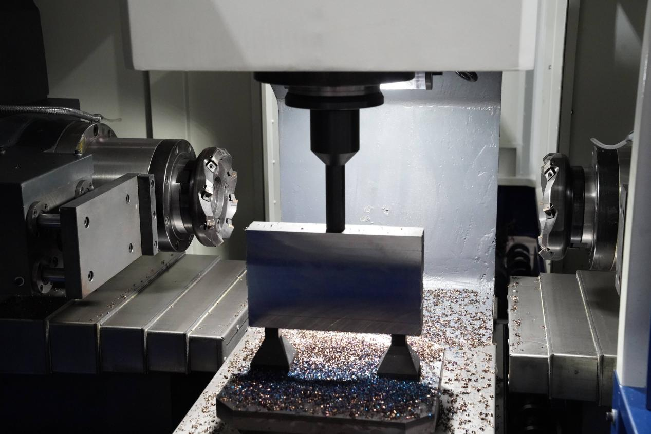 Duplex milling machine test cutting a metal block